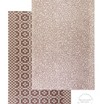 The large Brecon toddler play mat displays an abstract pattern and flips over to reveal a geometric motif on the reverse.