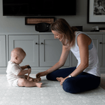 totter + tumble mom and baby playing on thick padded memory foam playmat in brer rabbit design
