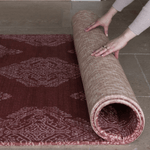 Hands unroll reversible thick play mat with stylish red and tan designs for stylish family homes unroll for practicality and style