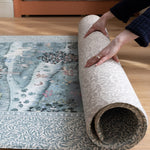 Unrolling a luxury foam play mat from the Totter + Tumble x Morris & Co. collaboration that is durable, easy-to-clean, and ideal for lovers of nature-inspired motifs in the nursery or playroom