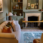 A Totter + Tumble decorative play mat styled in a heritage-inspired living room. It blends luxury nursery ideas with family-friendly, stylish design elements.