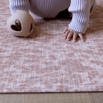 Baby support during crawling and tummy time on the supportive play mat by totter and tumble with a textural animal print design that looks modern in the family home while also offering floor time protection