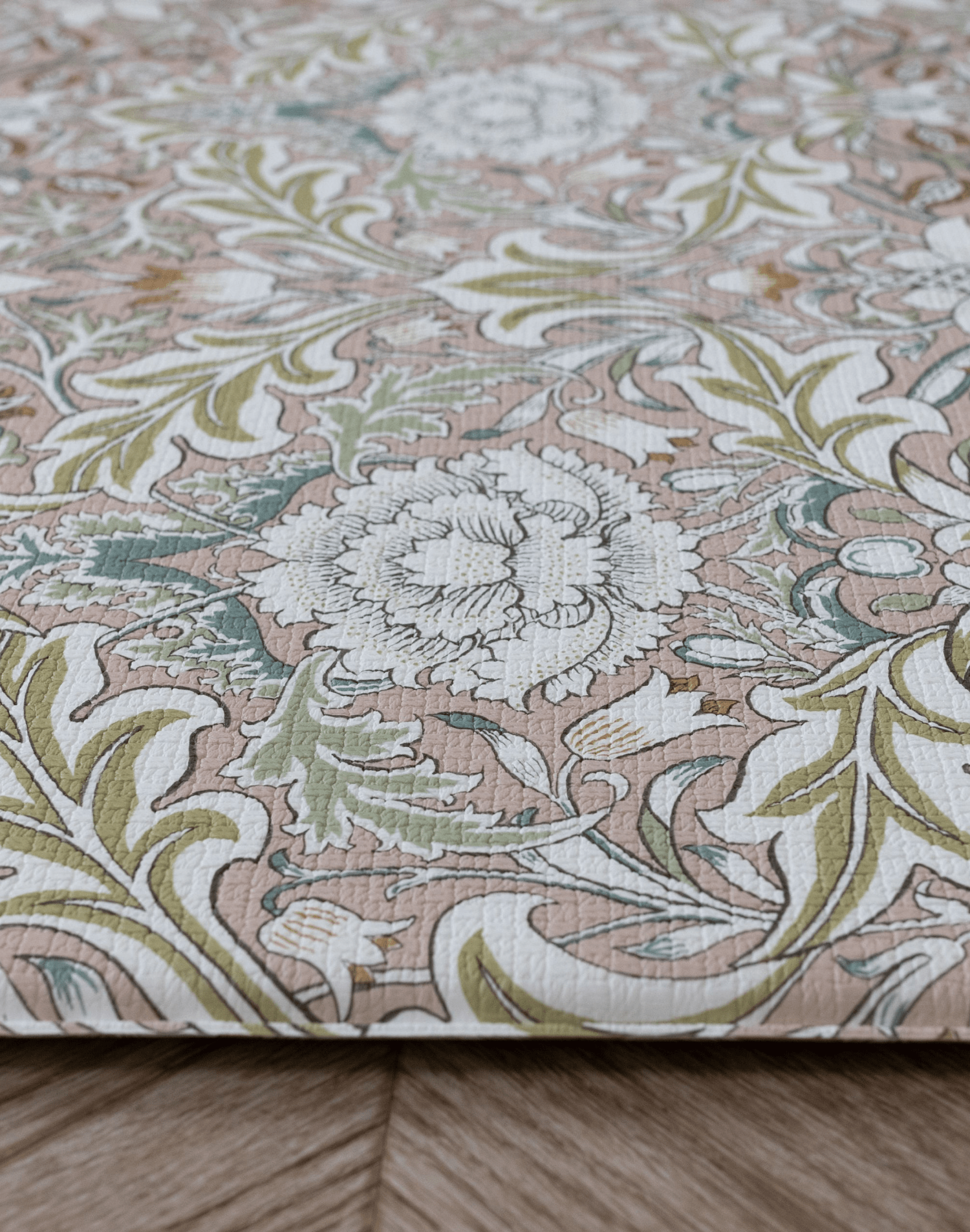 close up of severn print morris & co totter and tumble floral play mats in pretty pink playmat that looks like a totter and tumble rug, thick foam comfortable for babies tummy time practise