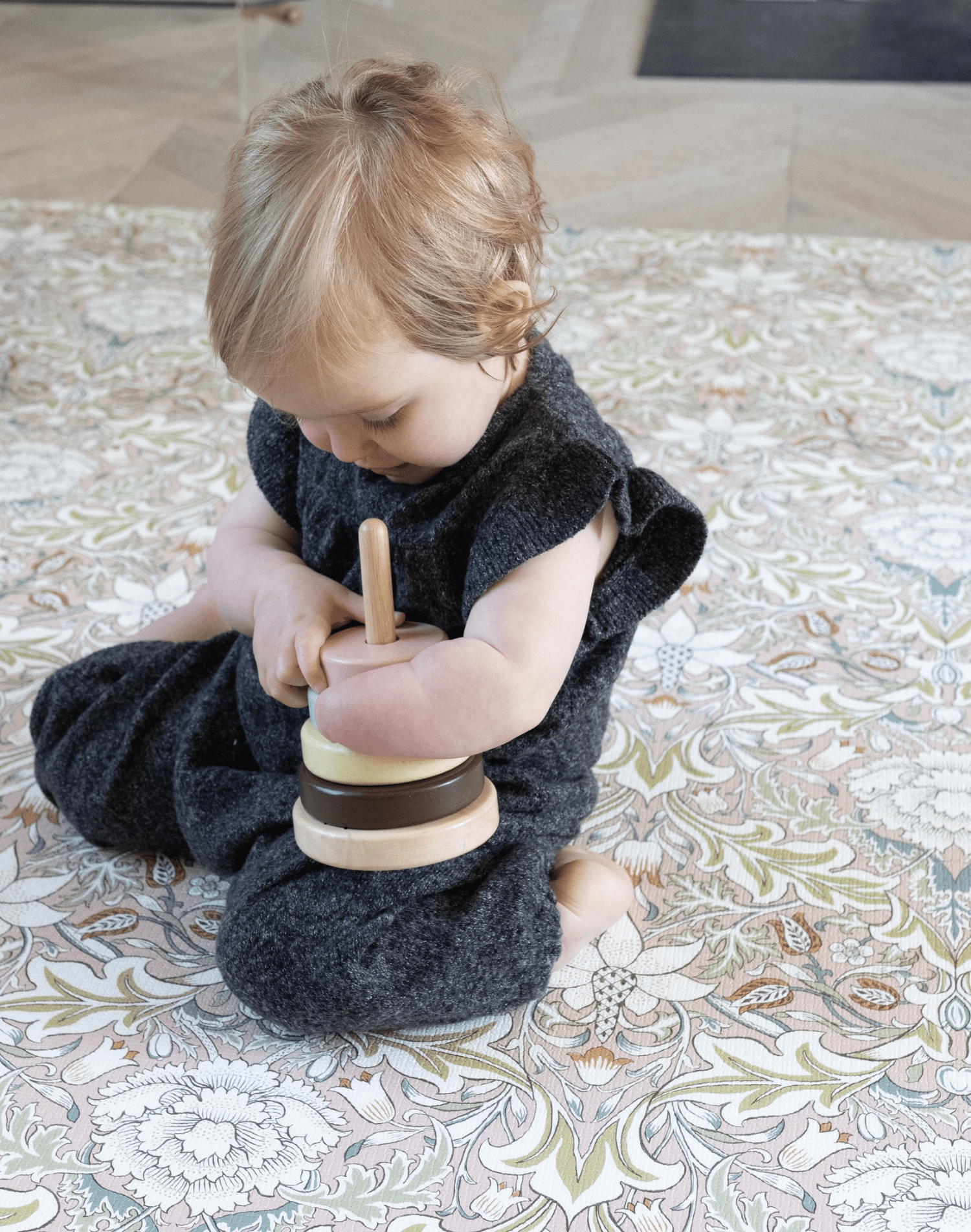 baby playing on totter and tumble playmat best baby buy that has great longevity throughout childhood and in tasteful designs for parents to enjoy too, great for christmas gifts for 1 year olds, baby shower presents.
