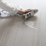 Wiping up spillage on Beige baby play mat made with memory foam and a beautiful gradient motif