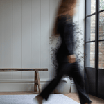 Lady walks across padded baby foam mat with grey leopard print motif that is subtle for the space