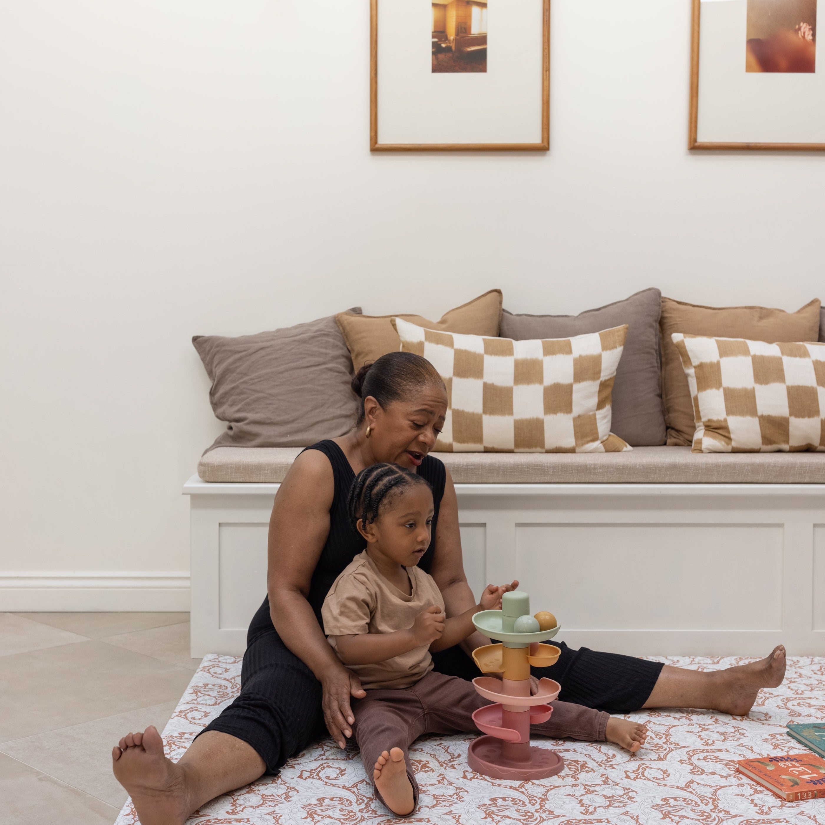 family playing on a soft supportive totter and tumble memory foam playmat