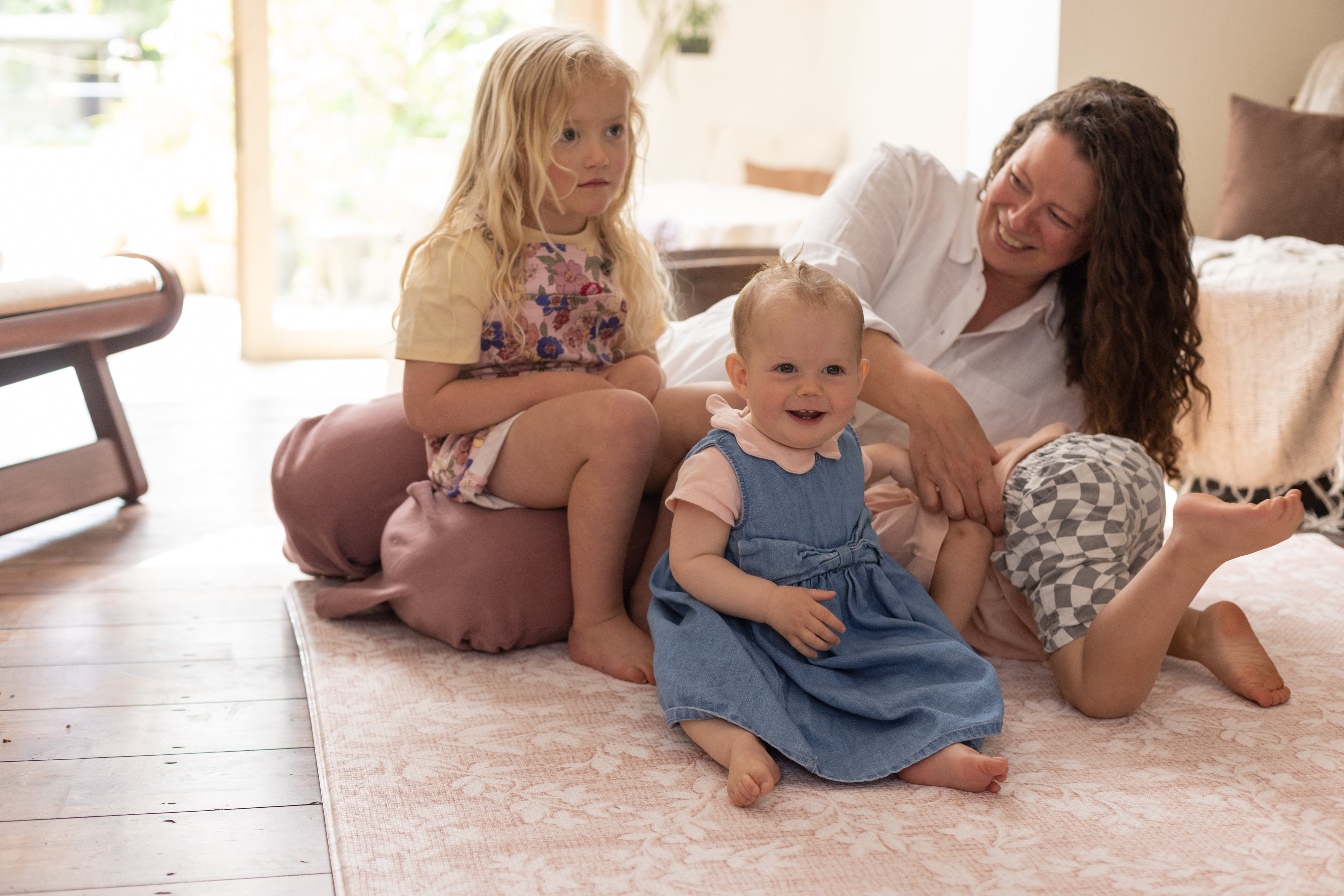 Family enjoy pink play mat for family floor time 