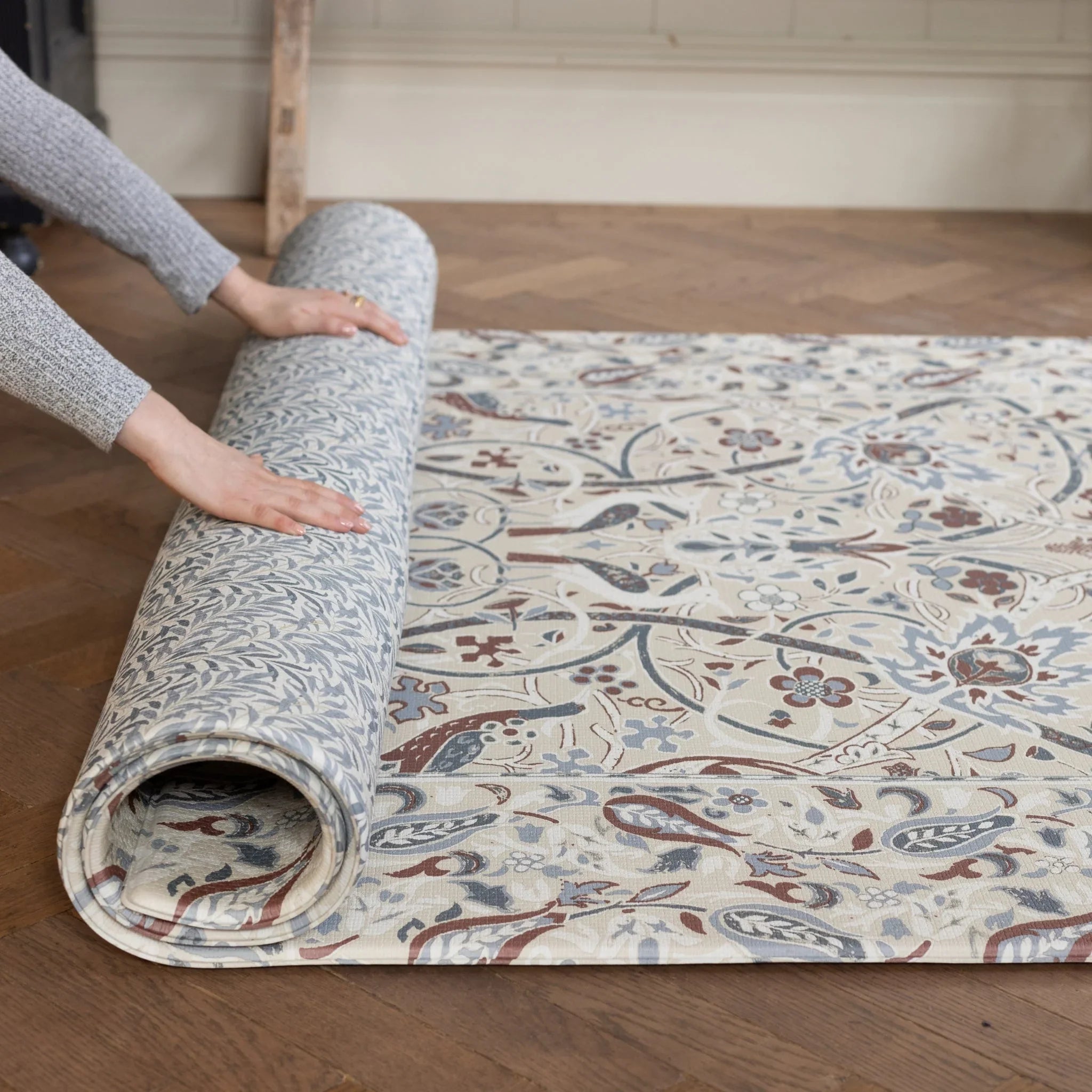 Morris & Co. patterned playmat in stone and woad colours. 