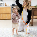 Woman and child playing on a designer baby play mat that matches home decor