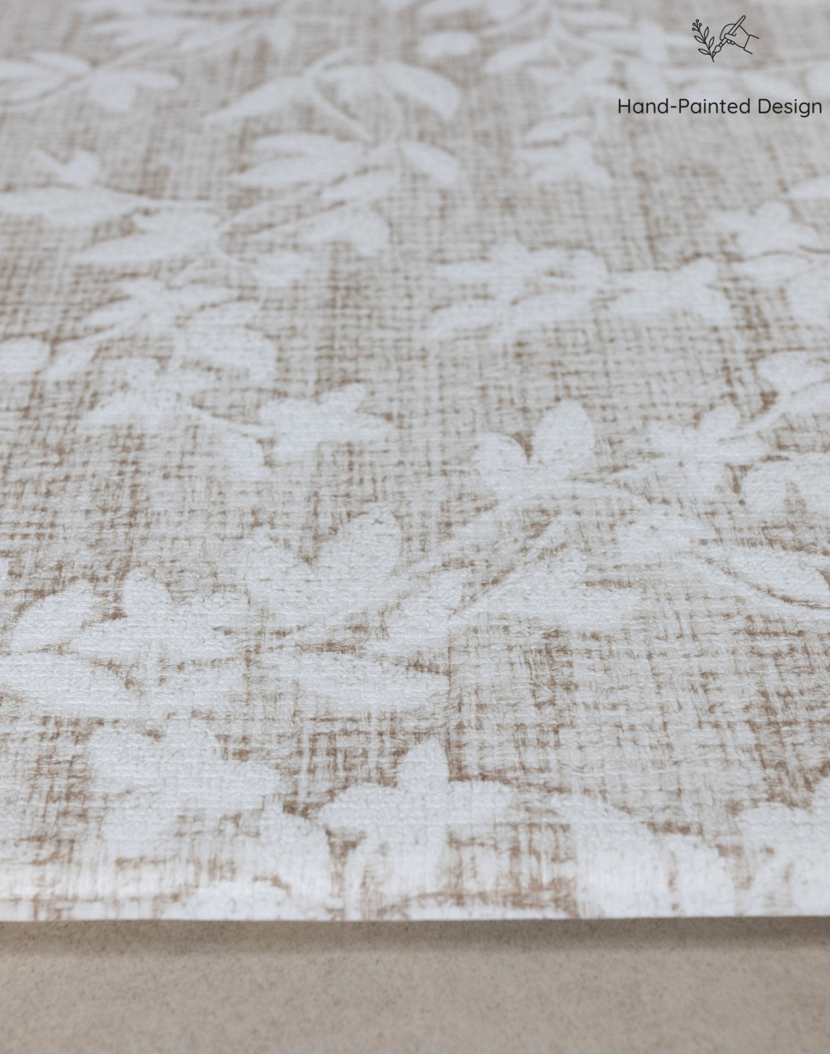 Close-up of cushion memory foam beige fabric with subtle floral pattern
tapis bébé design pour le salon