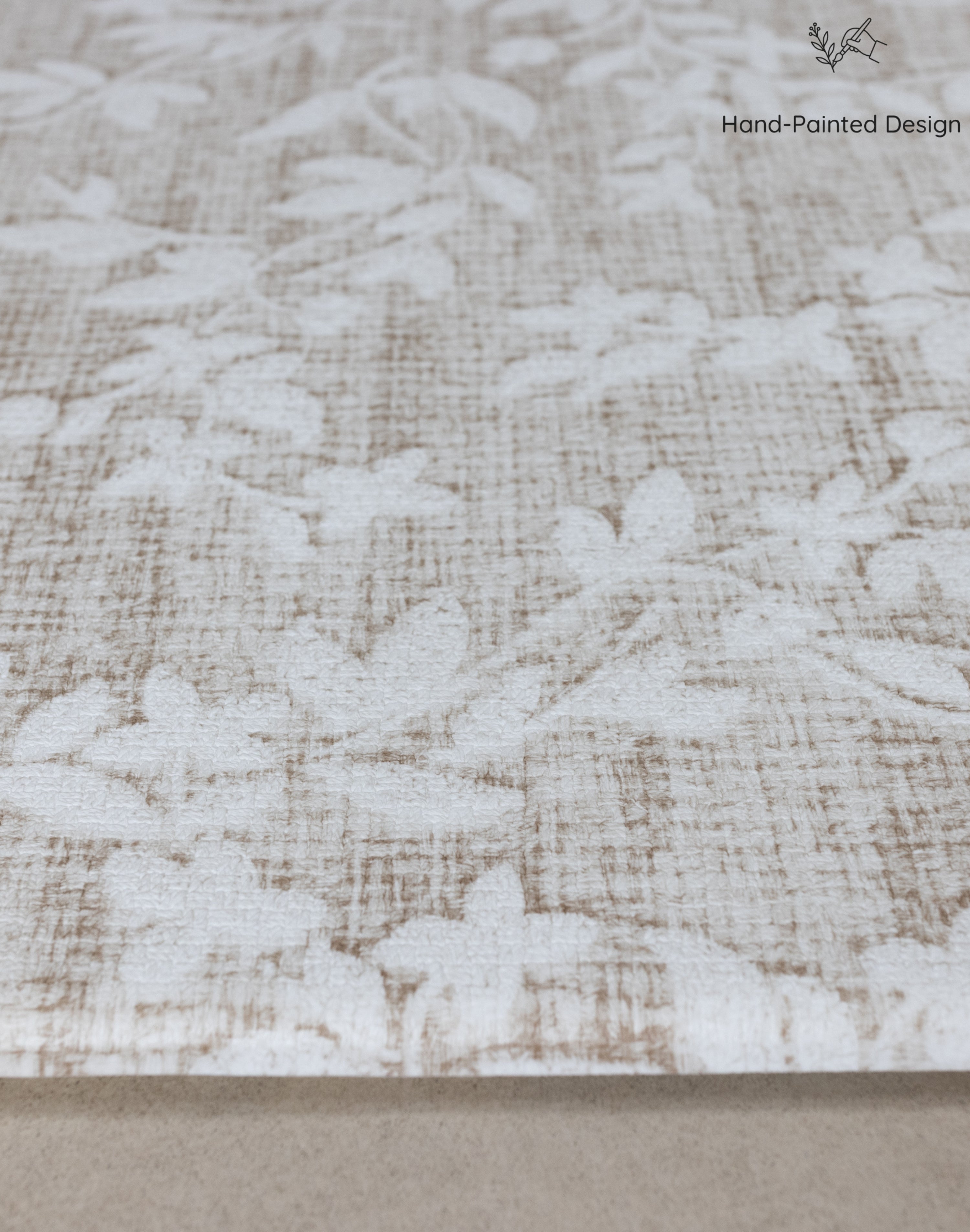 Close-up of cushion memory foam beige fabric with subtle floral pattern
tapis bébé design pour le salon