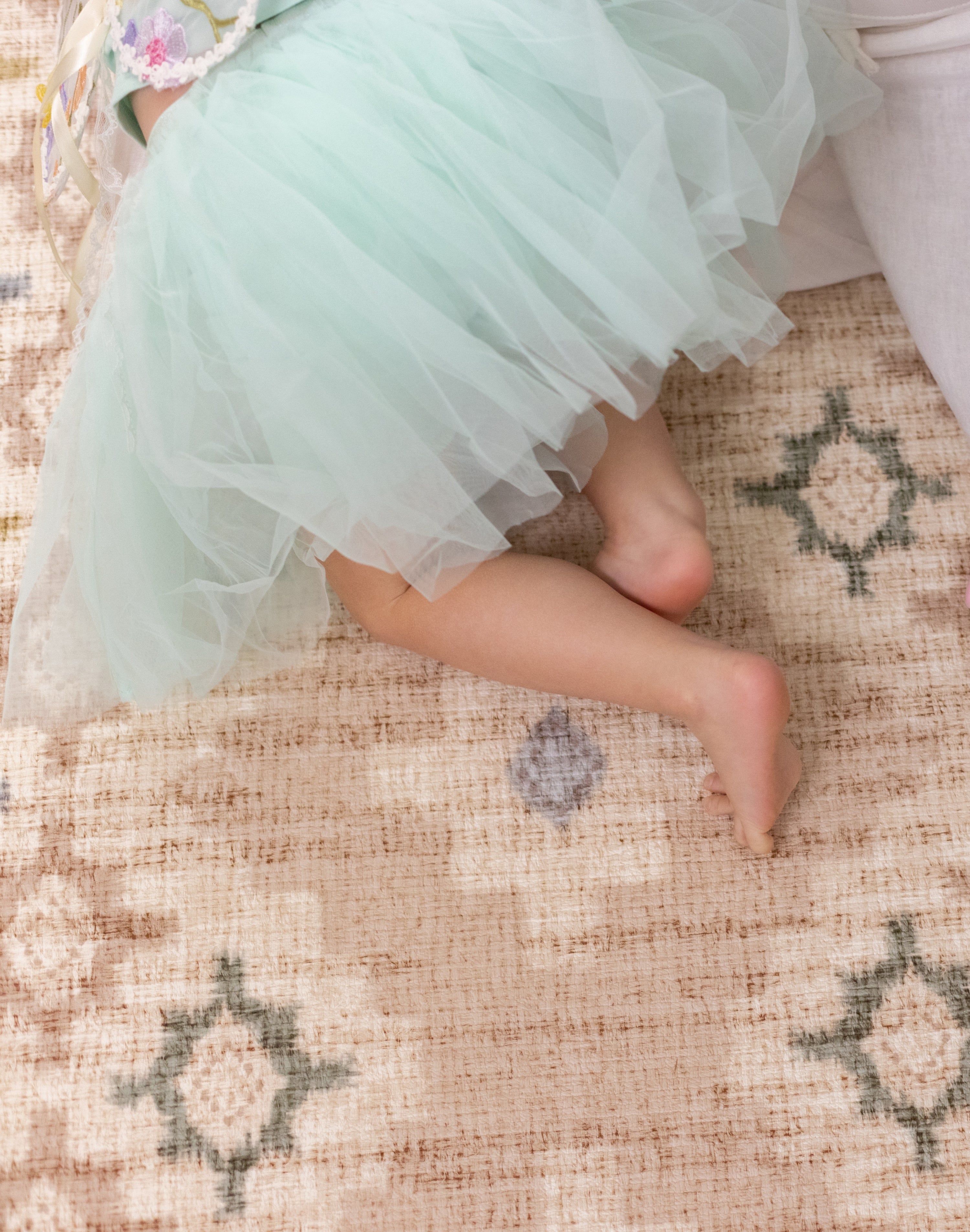 child crawling on a chic baby play mat that matches home decor