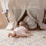 Baby playing on a high end baby play mat for contemporary homes and tummy time