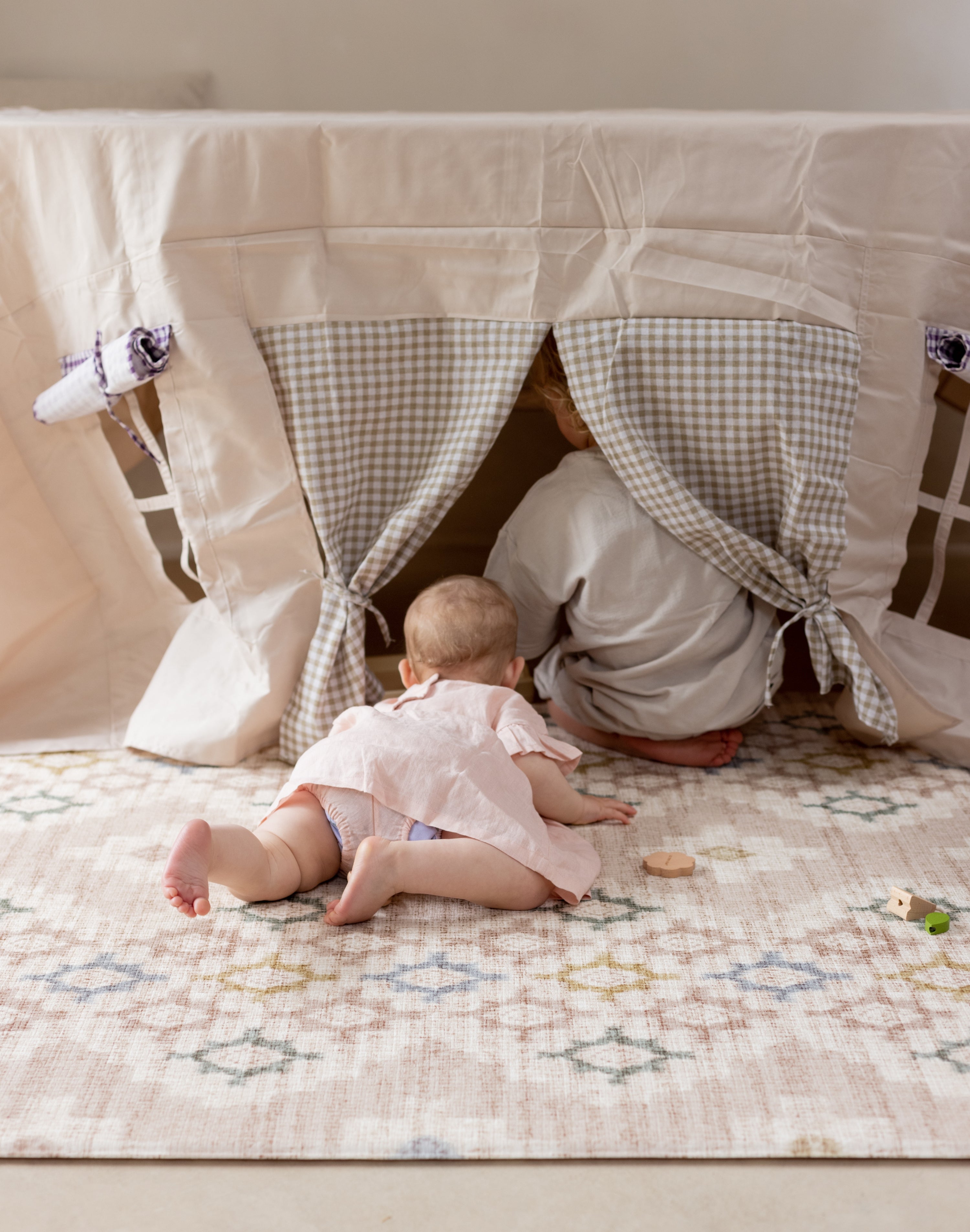 Baby playing on a high end baby play mat for contemporary homes and tummy time