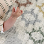 Cushioned mat for baby learning to roll safely