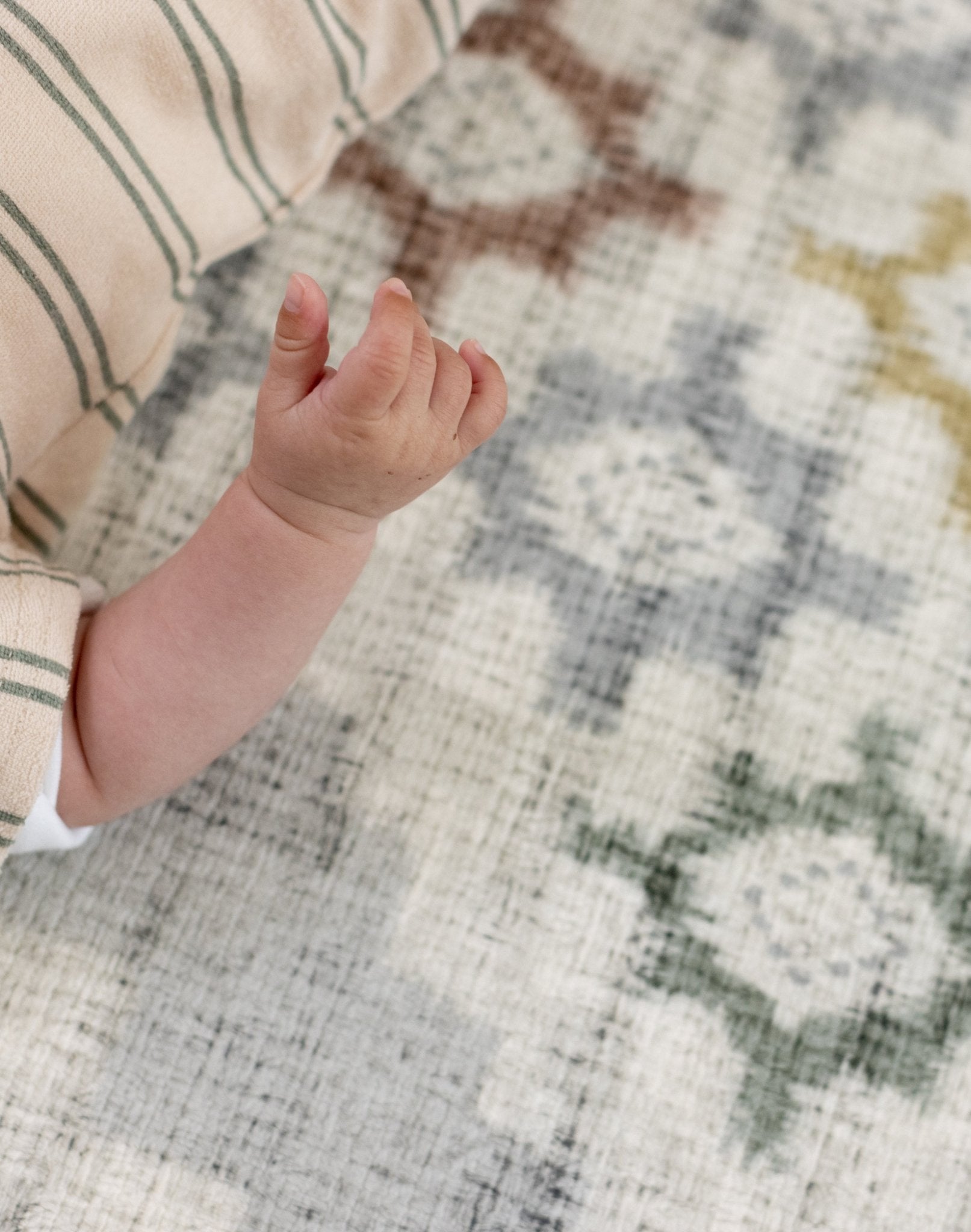 Cushioned mat for baby learning to roll safely