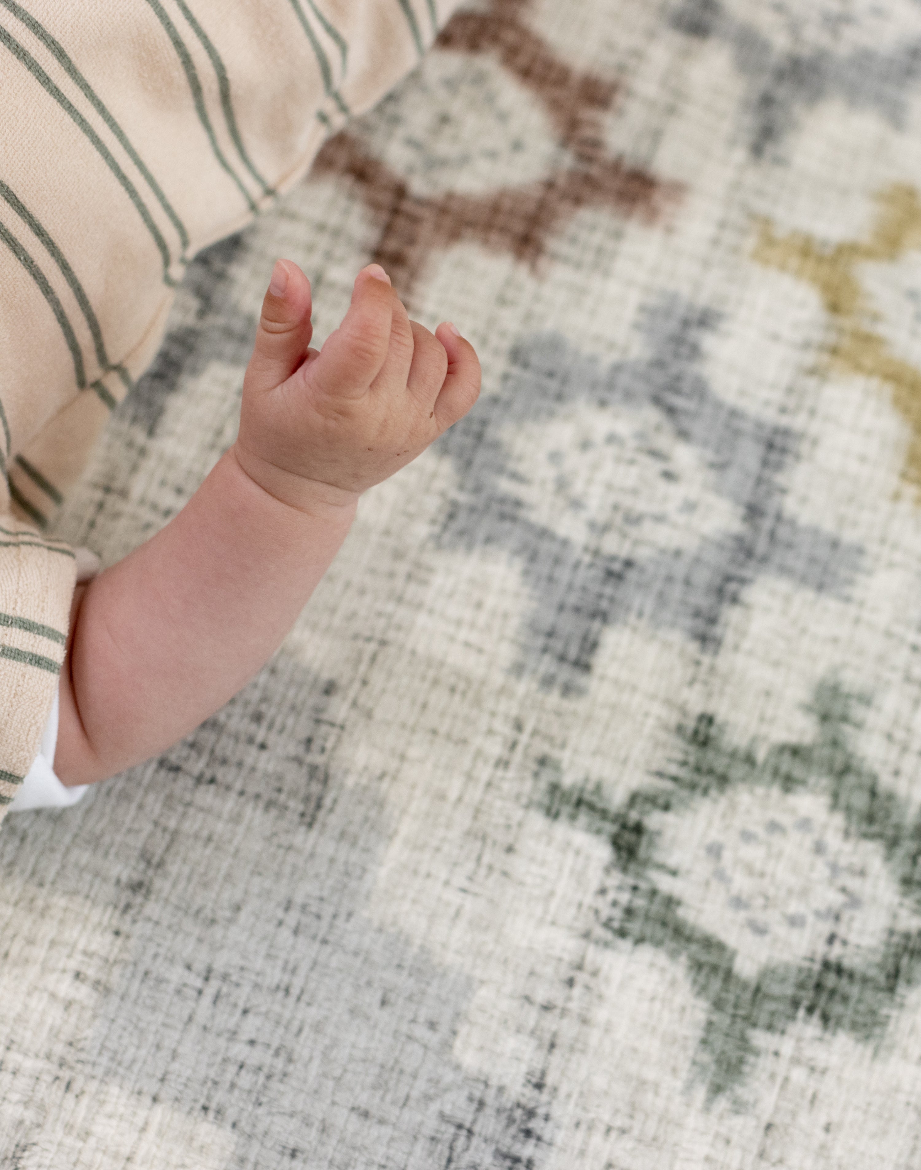 Cushioned mat for baby learning to roll safely