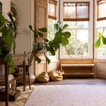 A room with a beautiful living room friendly baby play mat
