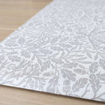 Detail of The Acorn Playmat’s floral woodland pattern - a practical yet stylish non-toxic play mat with an easy-care memory foam surface.