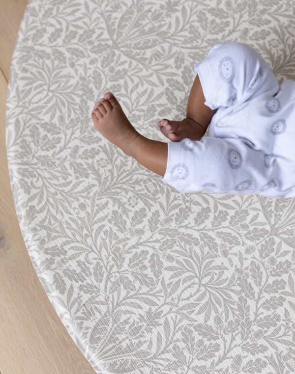 tiny toes on totter and tumble round size play mat padded thick memory foam comfortable and safe from newborn washable play mat wipedown and easy to clean, one piece and beautiful morris & co acorn grey play mat