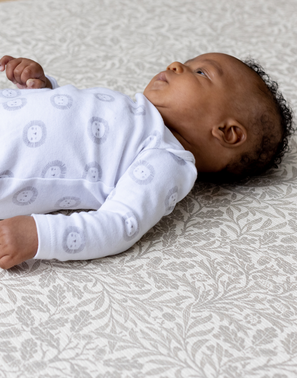Baby on totter and tumble Acorn play mat from morris & co collection, thick padded playmats supportive for babies and safe from newborn non toxic