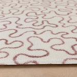 Detail of The Brecon’s abstract pattern playmat, inspired by Welsh heritage and designed in a soothing neutral palette.