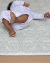 totter + tumble thick padded playmat with baby resting on floor mat made from memory foam kids play rug in morris & co brer rabbit print beautiful rug alternative for the family home wipe down and reversible designs