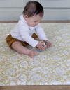 baby playing on padded play mat from totter and tumble comfortable and supportive area rug. waterproof playmat tapis de jeu, 