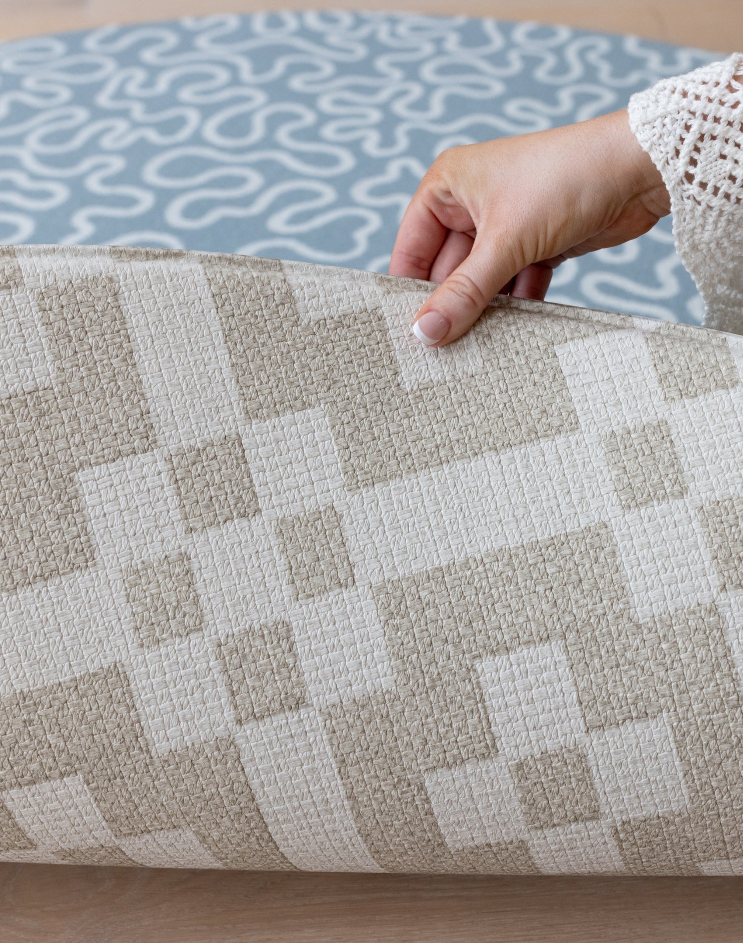 Close-up of The Holbein’s reversible design and tufted texture, an abstract pattern playmat inspired by Wales.