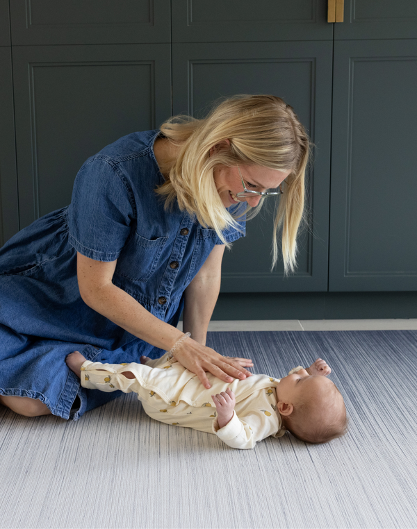 Mother and baby together on Baby play mats by Totter and Tumble are safe from birth and perfect for tummy time with mouldable memory foam to support little ones building strength 