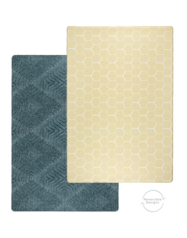 A double-sided play mat with a quiet, unobtrusive pattern