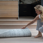 Unrolling a reversible playmat in a modern kitchen