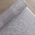 Close up of the double sided grey playmat with two textural designs to look good in modern family homes luxury memory foam provides protection for the family on the floor enjoying playtime and exercise