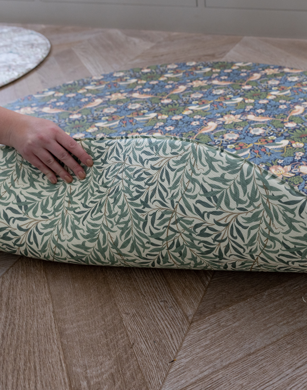 morris & co strawberry thief reversible double sided playmat totter and tumble with morris & co willow boughs iconic leafy print on its reverse for a calm and comfortable space for your baby to practise tummy time sealed memory foam playmats look like pretty padded playrugs
