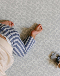 Baby crawling on the beachcomber rug-like, soft, safe, baby playmat from totter and tumble