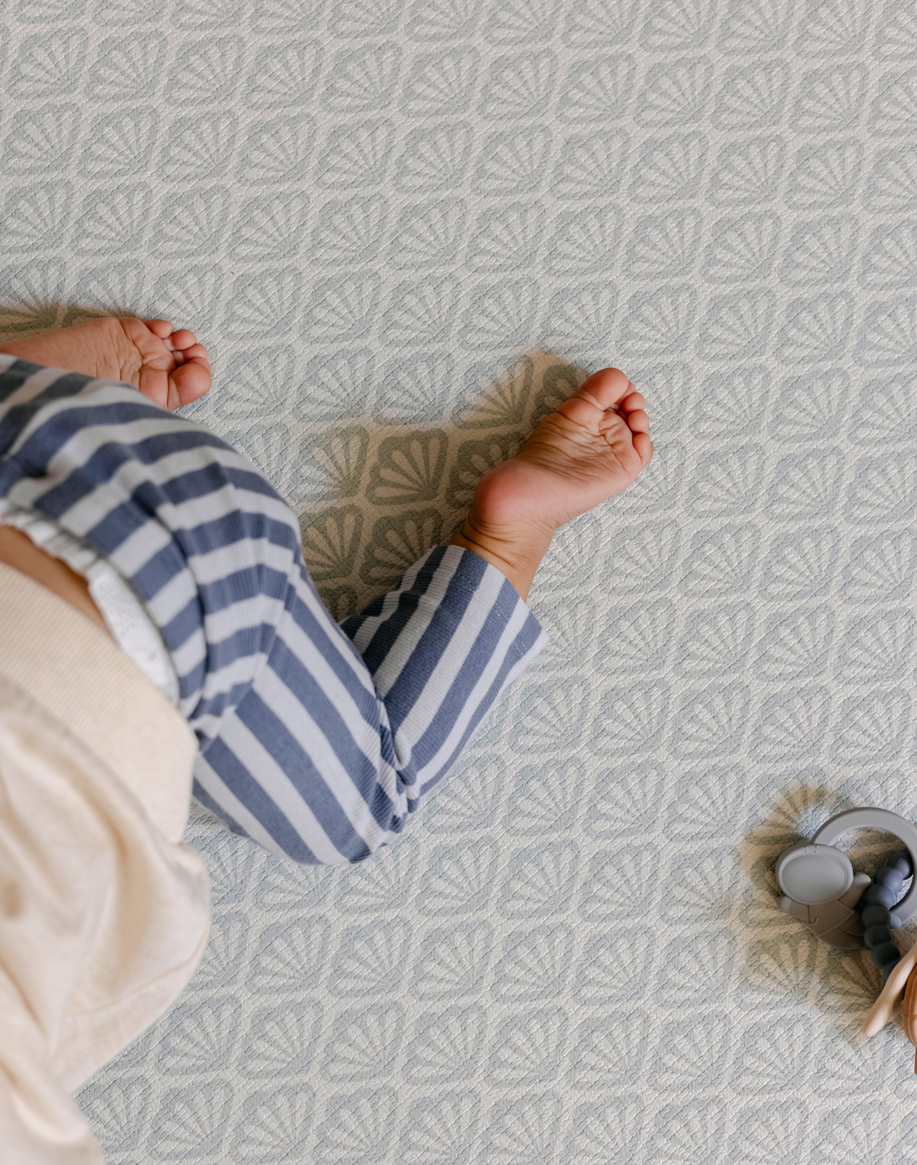 Baby crawling on the beachcomber rug-like, soft, safe, baby playmat from totter and tumble