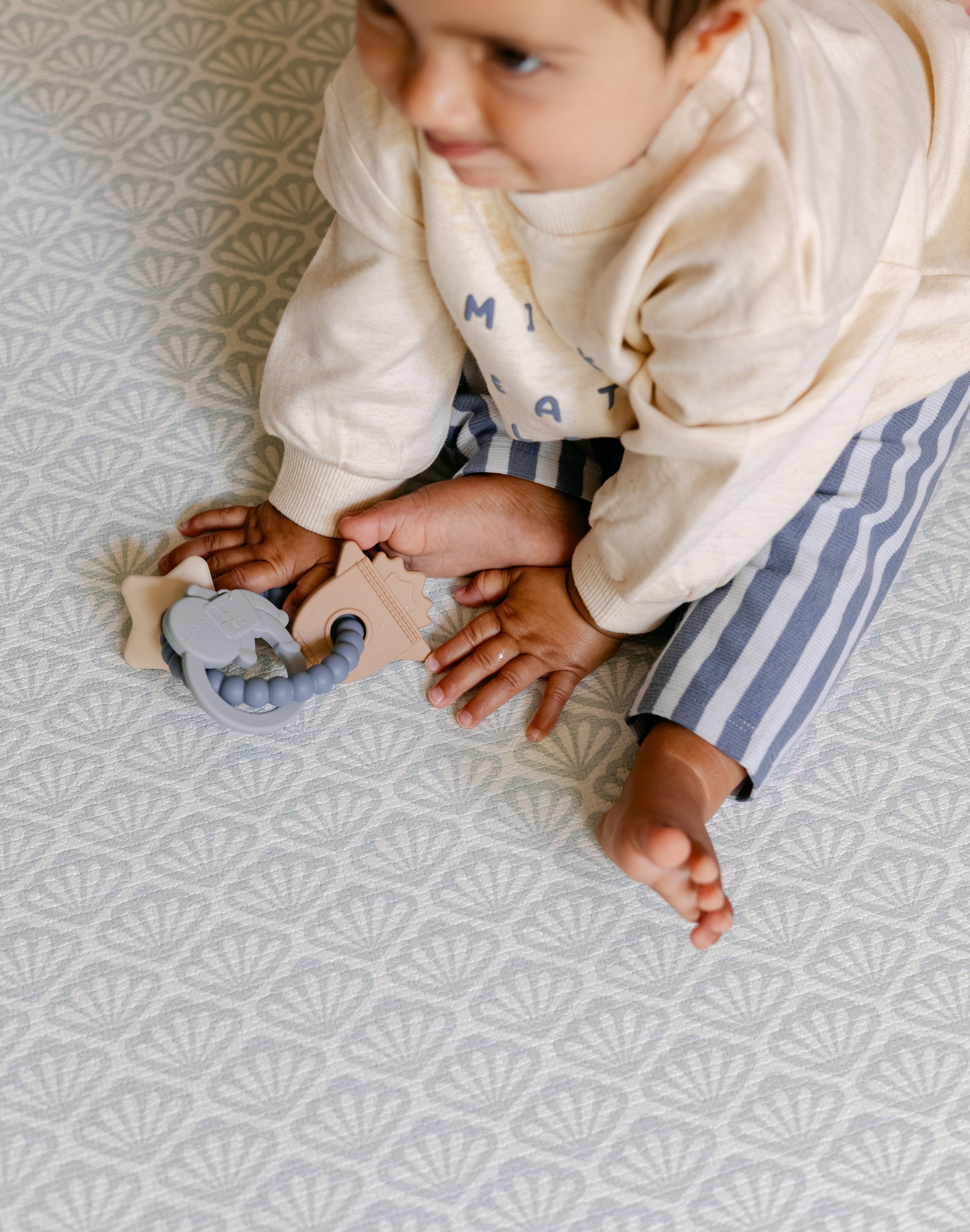 A baby sat comfortably on the thick memory foam beachcomber playmat | SKU: 26 BEACH/GATHER XL, 26 BEACH/GATHER STD, 26 BEACH/GATHER COMP