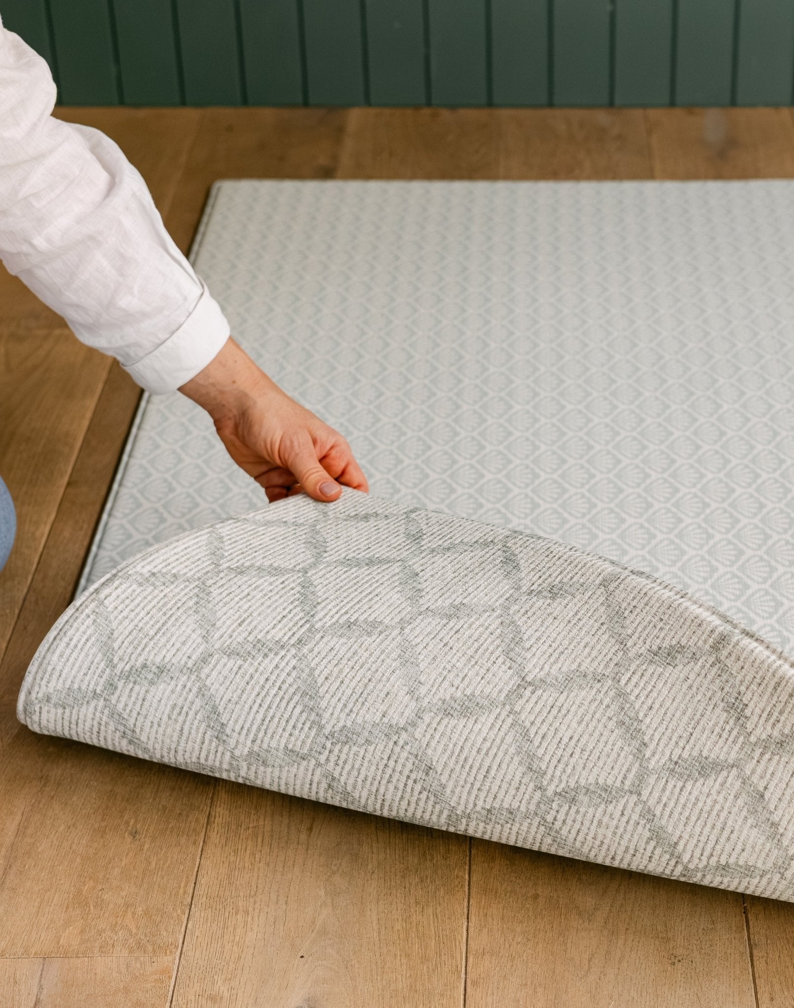 Someone showcasing both sides of the beachcomber coastal inspired playmat | SKU: 26 BEACH/GATHER XL, 26 BEACH/GATHER STD, 26 BEACH/GATHER COMP