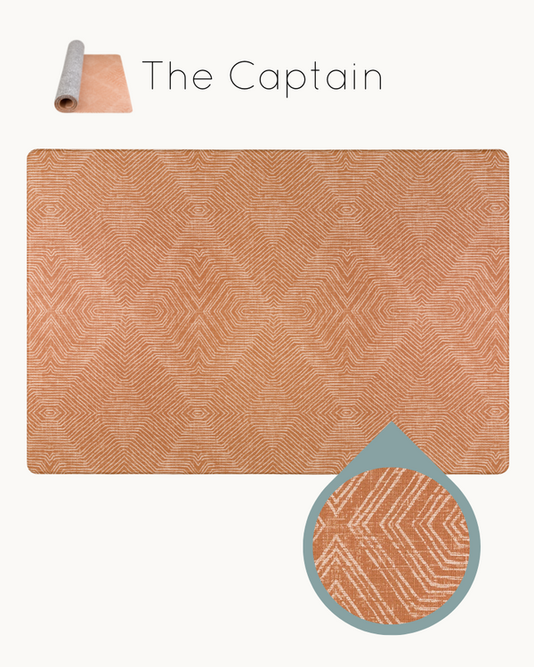 The Captain totter and tumble padded play mat for toddlers in warm terracotta tone waterproof playmat suitable from newborn. Stylish family home play rug