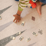 Children playing dominos on The Counter wipeable reversible memory foam playmat from Totter + Tumble