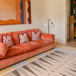 The Counter wipeable reversible memory foam playmat from Totter + Tumble in a bright modern living space