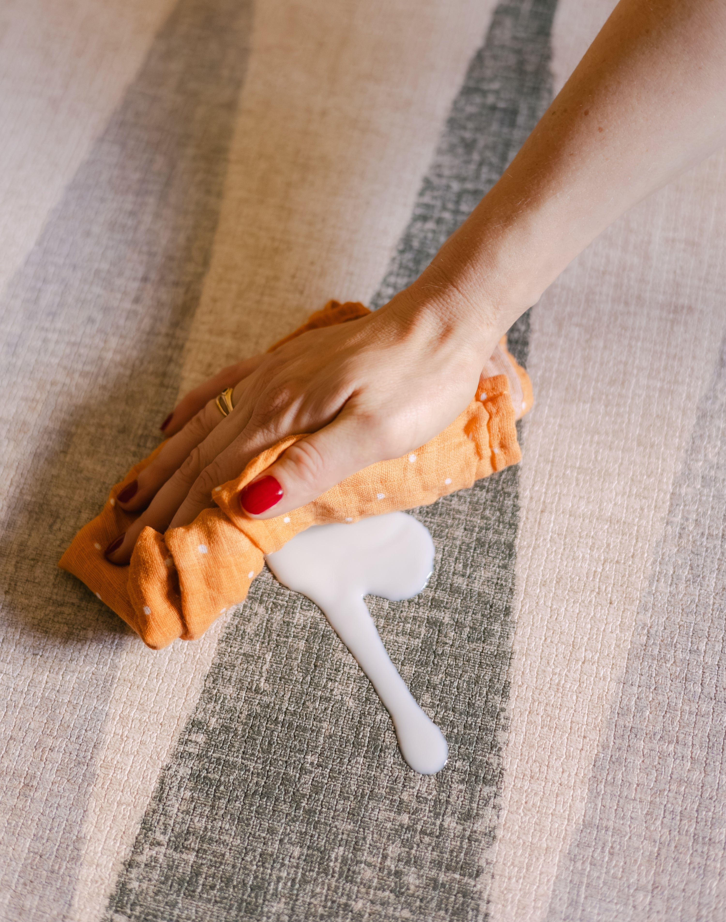 Wipe up on The Counter reversible memory foam playmat from Totter + Tumble