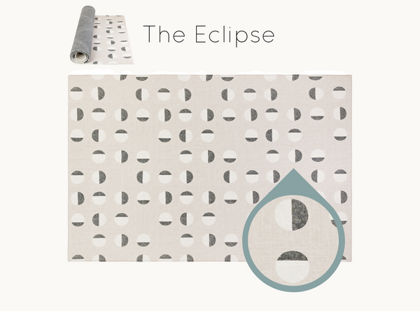 Stylish monochromatic eclipse inspired motif across modern memory foam, wipe clean playmat