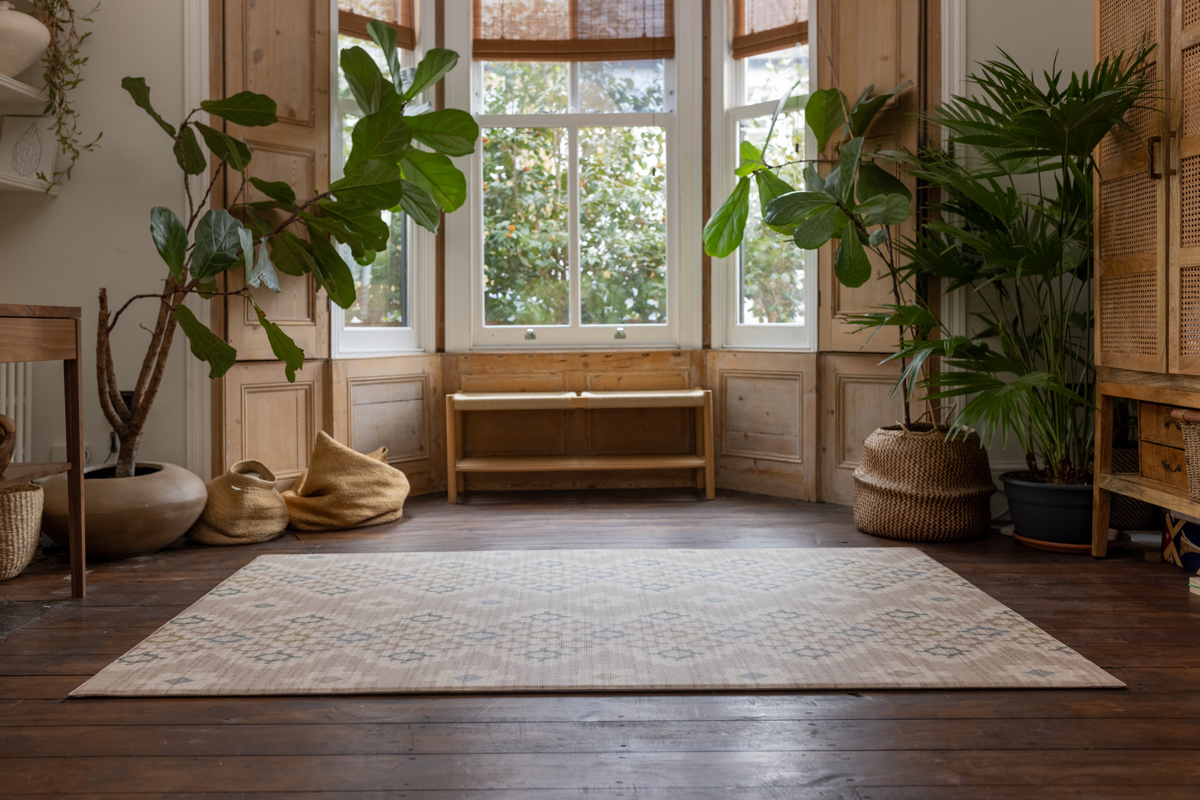 rug-like totter and tumble playmat in a geometric pattern