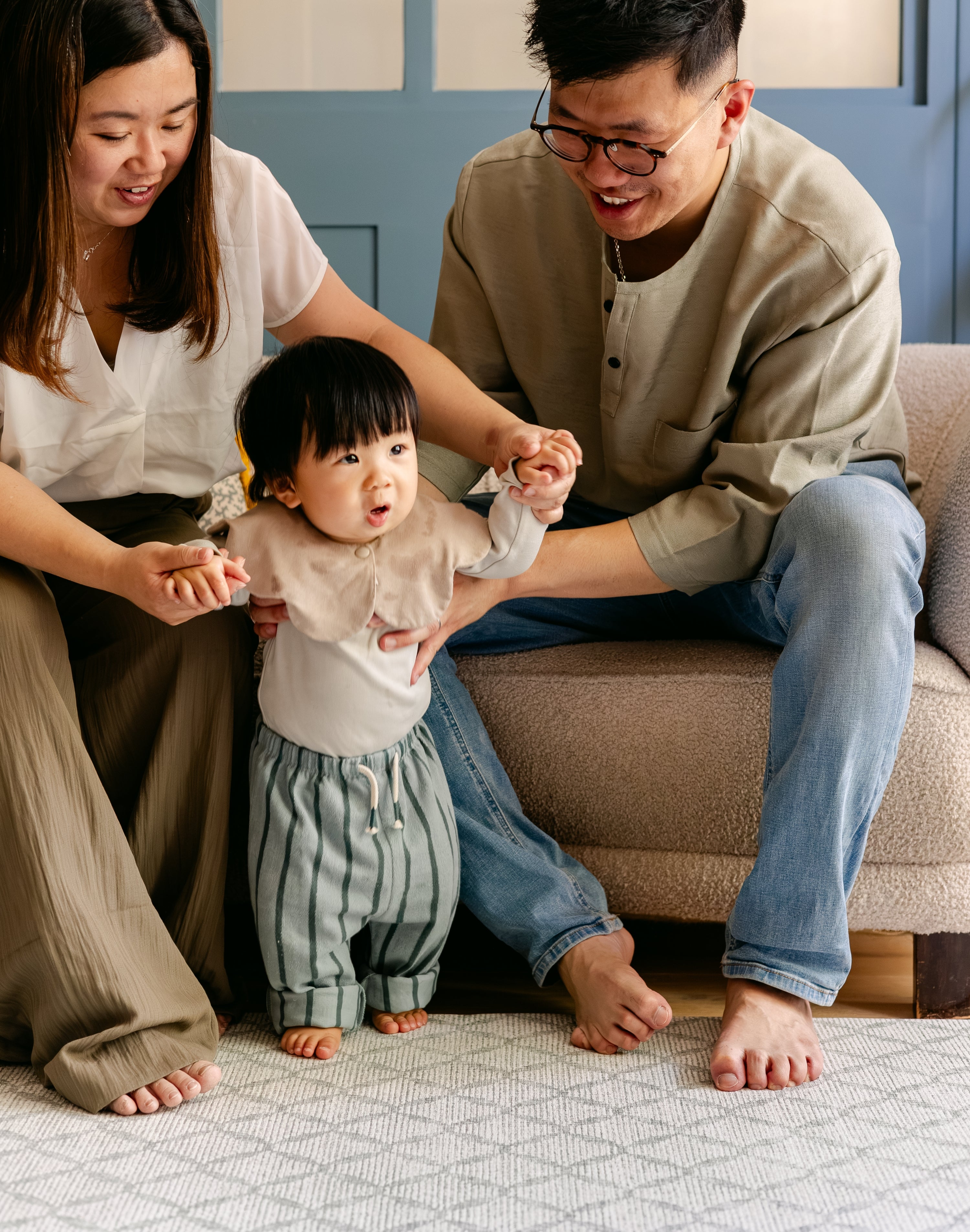 A family helping a baby to walk safely on a soft thick non toxic rug-like totter and tumble playmat | SKU: 26 BEACH/GATHER XL, 26 BEACH/GATHER STD, 26 BEACH/GATHER COMP