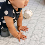 A baby pressing there hands down on a soft,safe, comfortable, memory foam playmat from totter and tumble | SKU: 26 BEACH/GATHER XL, 26 BEACH/GATHER STD, 26 BEACH/GATHER COMP