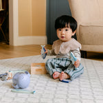 A baby sat playing on a comfortable, safe, non toxic, rug-like totter and tumble playmat | SKU: 26 BEACH/GATHER XL, 26 BEACH/GATHER STD, 26 BEACH/GATHER COMP