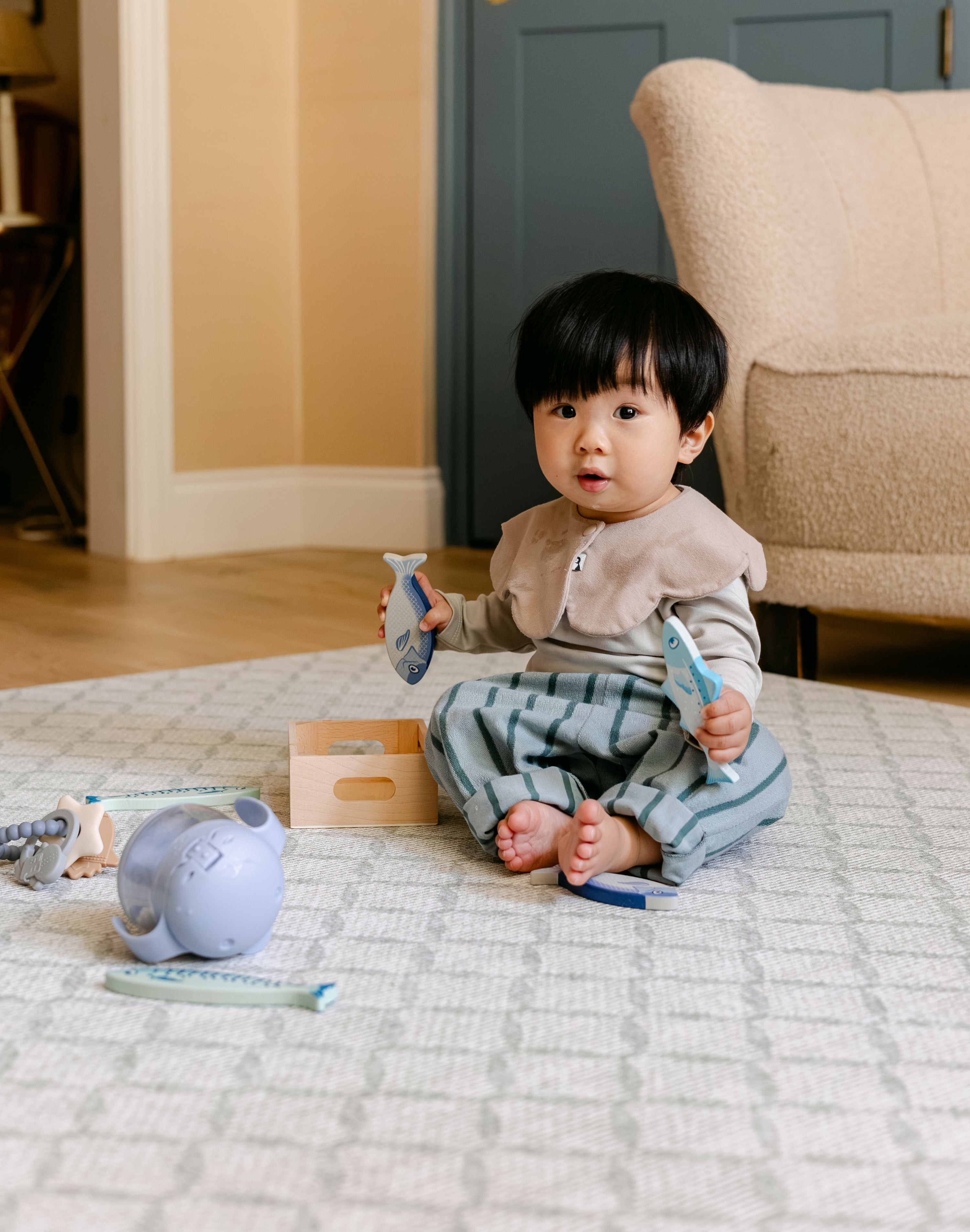 A baby sat playing on a comfortable, safe, non toxic, rug-like totter and tumble playmat | SKU: 26 BEACH/GATHER XL, 26 BEACH/GATHER STD, 26 BEACH/GATHER COMP