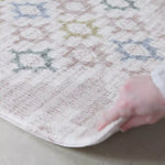 video of 'the fable and the aster' reversible pink totter and tumble rug-like playmat